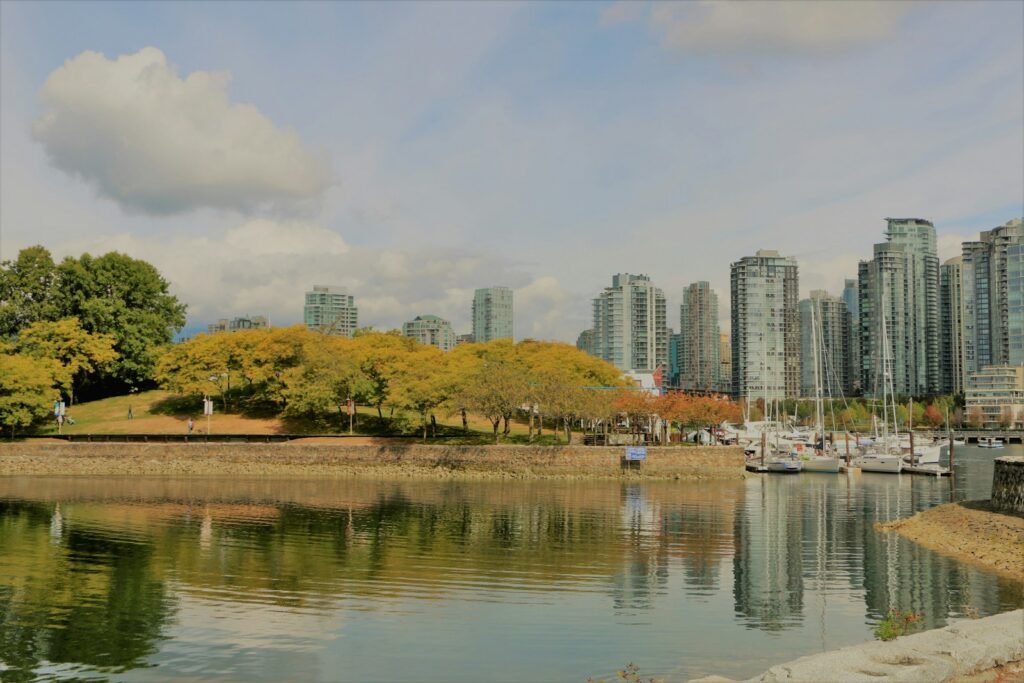 white and brown buildings near body of water during daytime