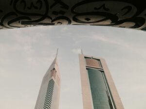 a couple of tall buildings sitting next to each other