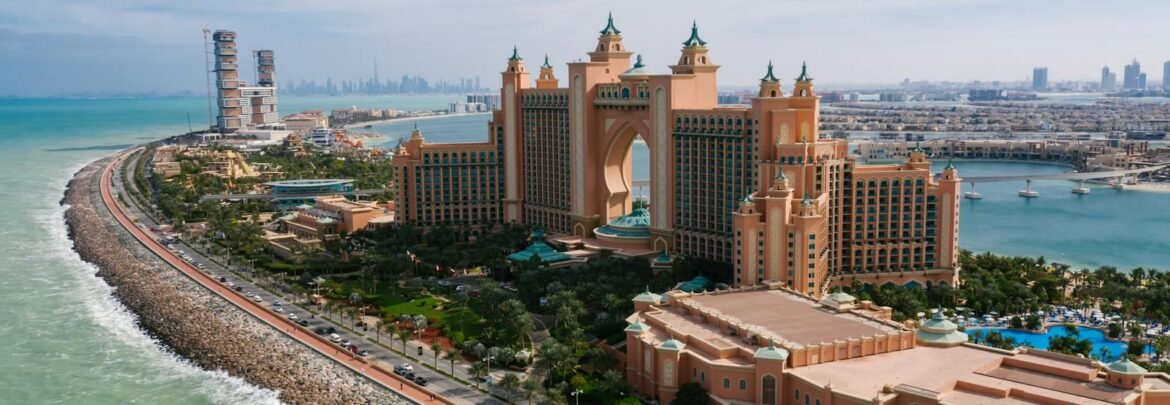 A breathtaking drone shot of Atlantis, The Palm resort in Dubai, highlighting the luxurious urban landscape.