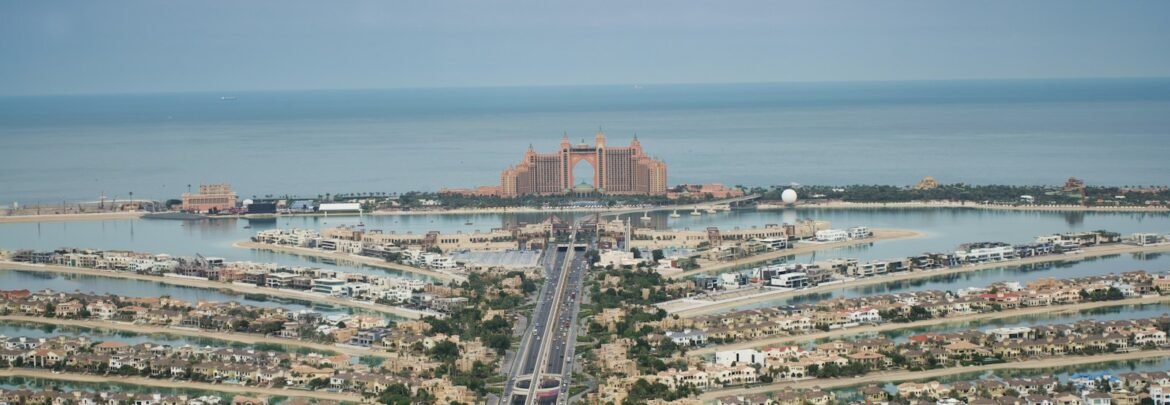 an aerial view of a city and a body of water