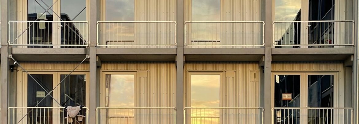 a tall building with multiple balconies and balconies