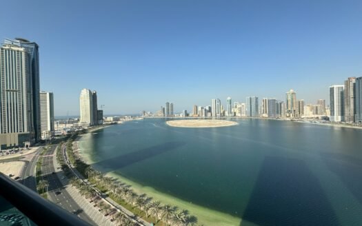a large body of water surrounded by tall buildings