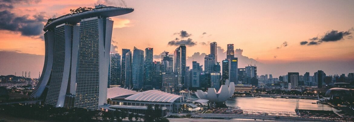 a large body of water with a city in the background