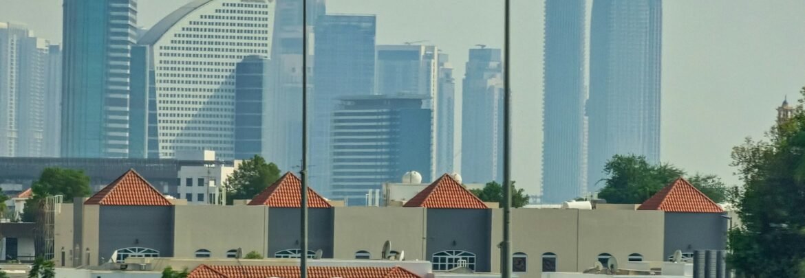 a view of a city with tall buildings in the background