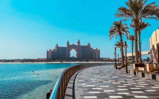 white concrete building near body of water during daytime