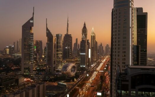 a view of a city at night from the top of a building