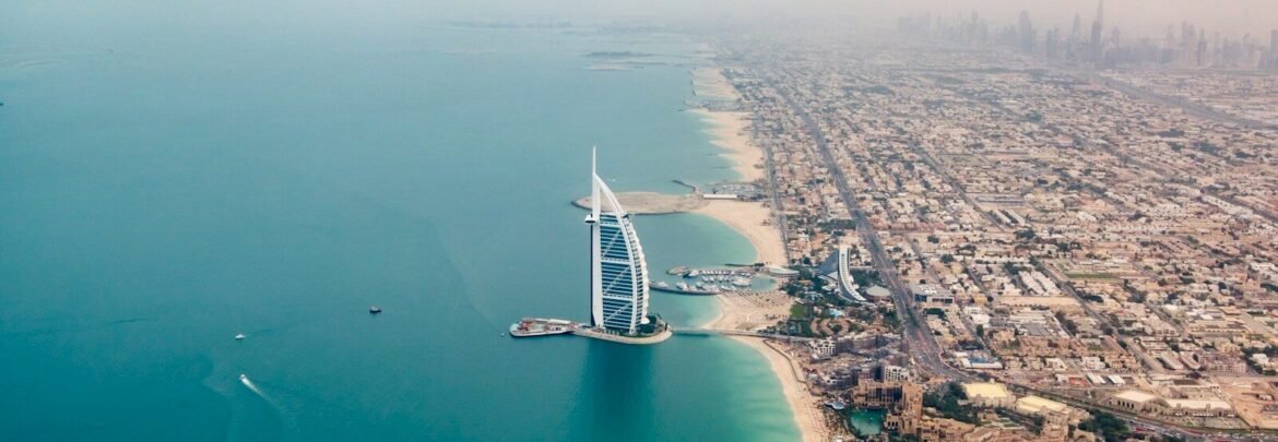 an aerial view of the burj al arab in the middle of the ocean