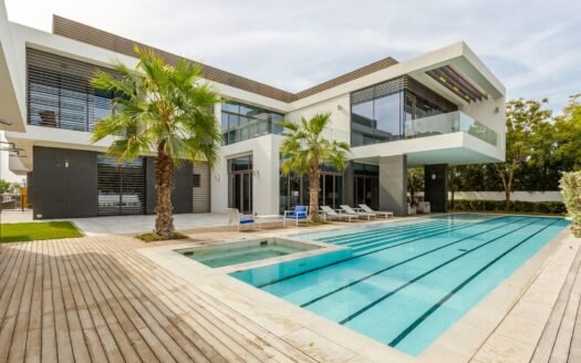 Explore this luxurious modern villa in Dubai with a stunning swimming pool and palm trees.