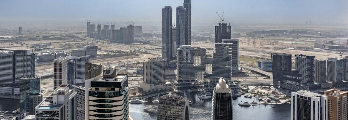 An aerial view of a city with tall buildings