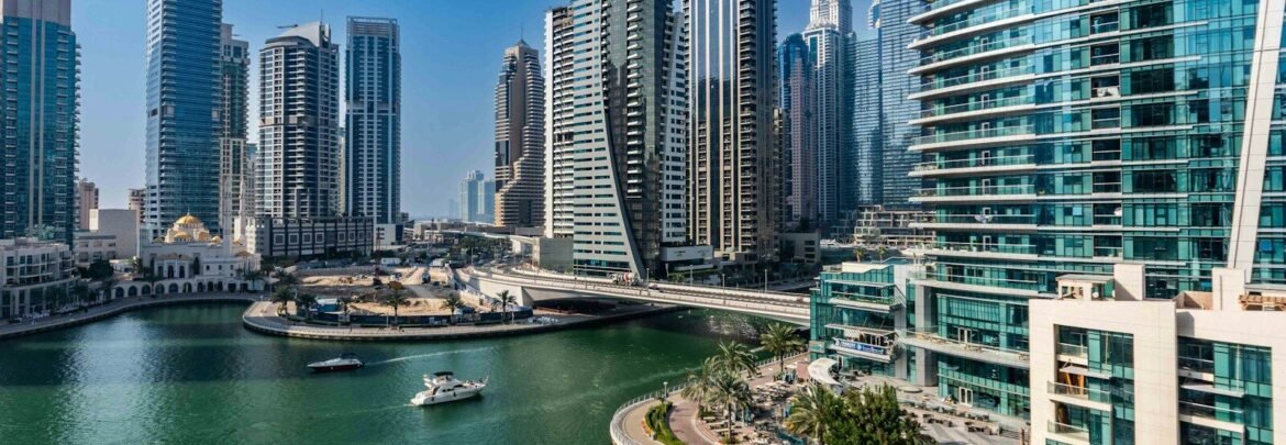 A river running through a city next to tall buildings
