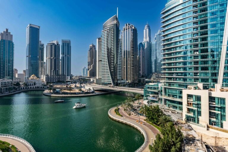 A river running through a city next to tall buildings
