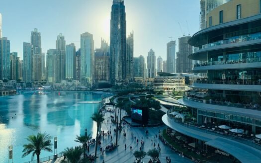 people walking on the street near high rise buildings during daytime