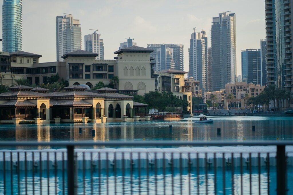 A body of water with buildings in the background
