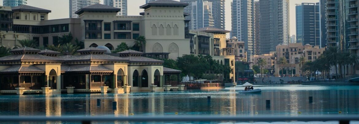 A body of water with buildings in the background