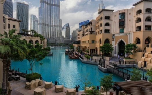 a large swimming pool surrounded by tall buildings