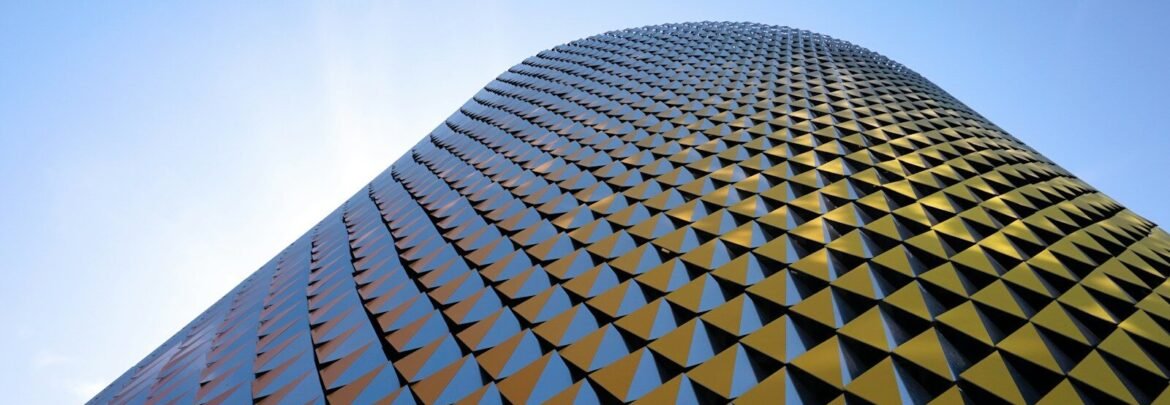 a very tall building with a sky background
