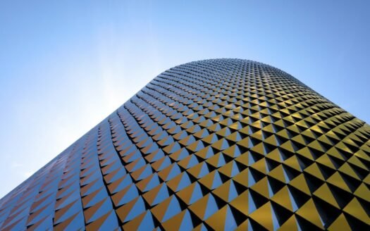 a very tall building with a sky background