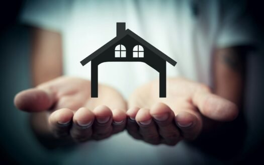 Hands holding a silhouette of a house