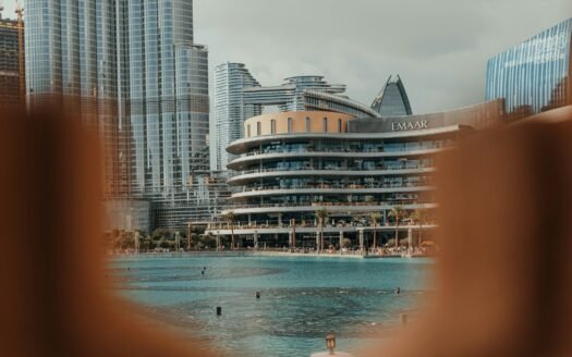 A blurry photo of a city with a pool