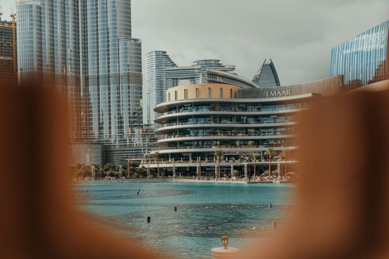A blurry photo of a city with a pool