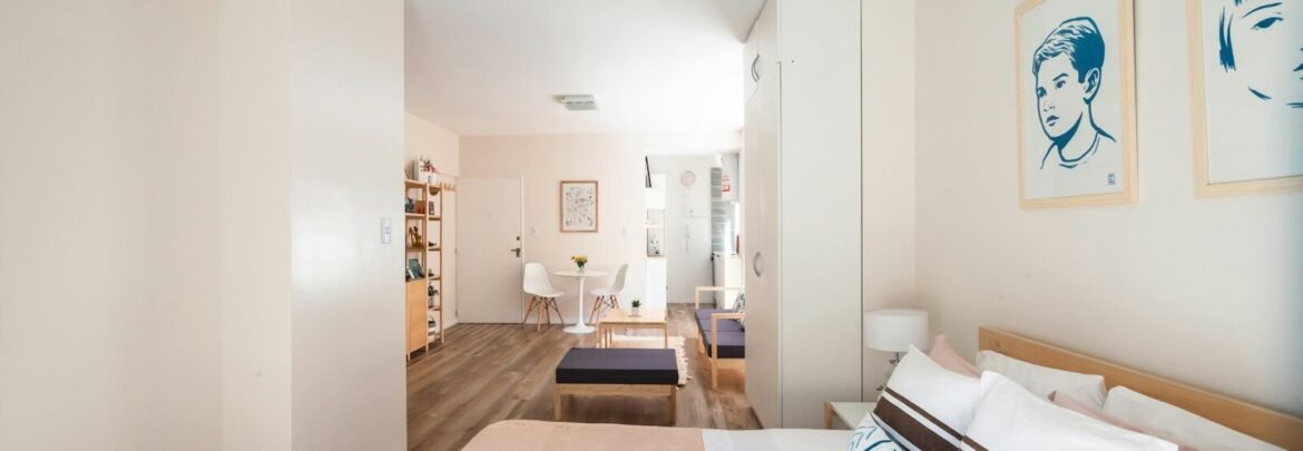 a bedroom with a bed and a couch