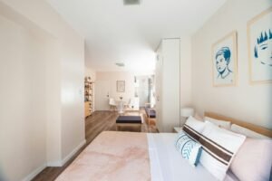 a bedroom with a bed and a couch