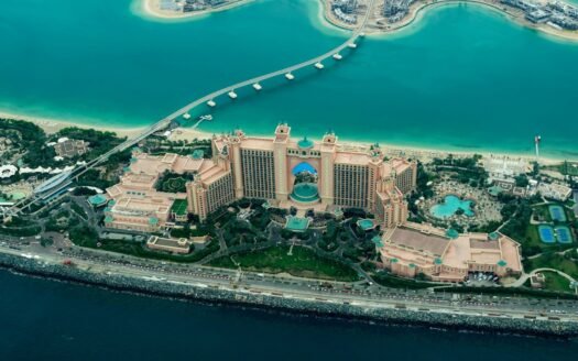 aerial photography of concrete buildings on the middle of the sea